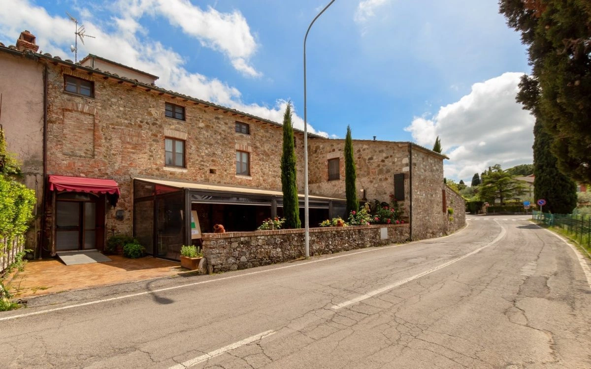 Villa in a suburb of Siena in a historic stone building, Italy